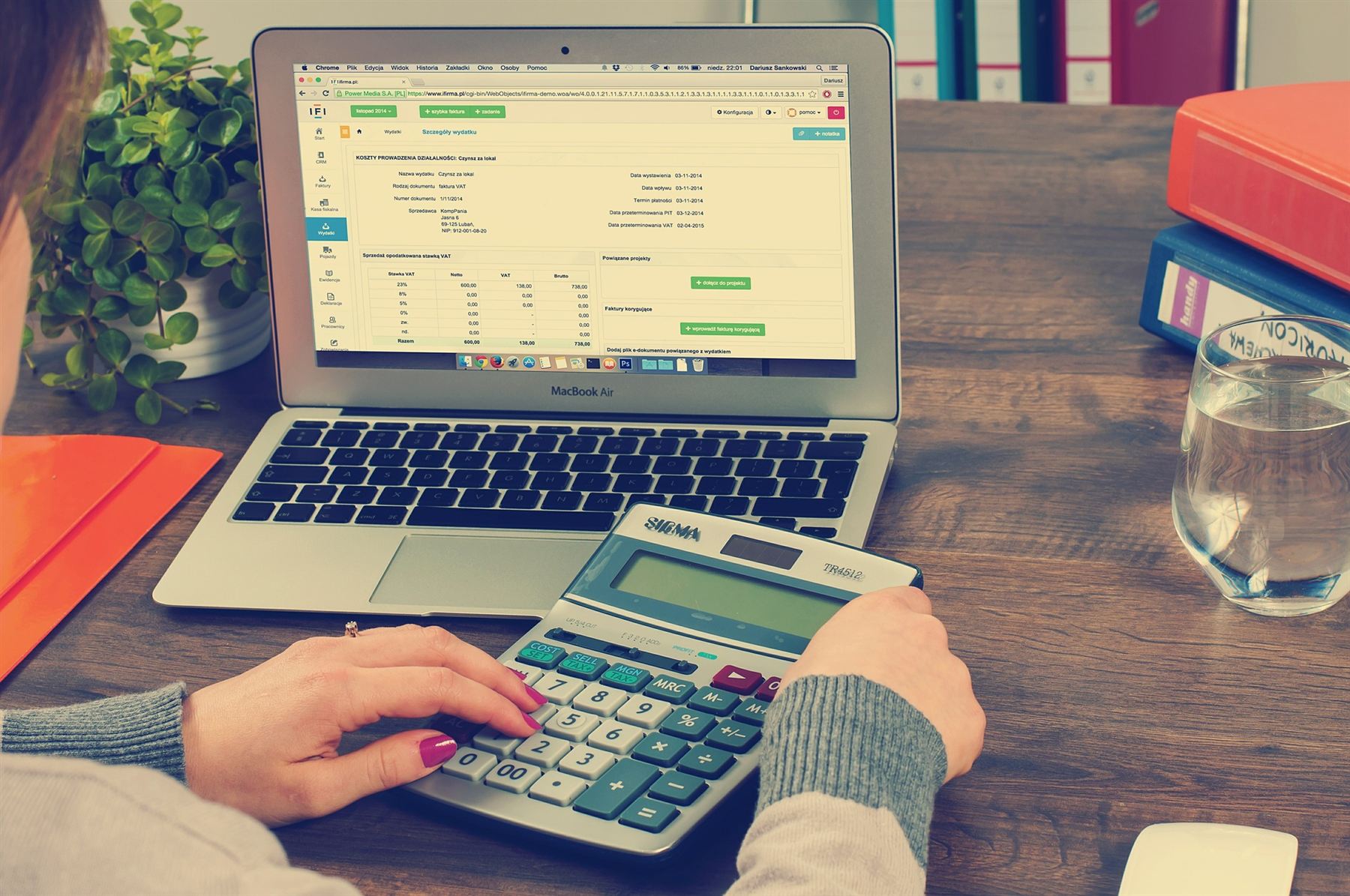 Working through figures with a laptop and calculator